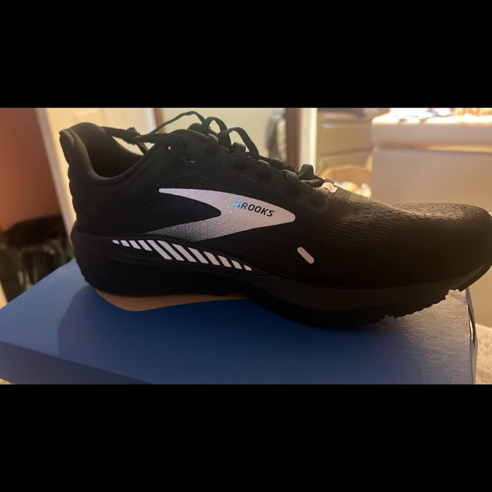 Men’s Brooks running shoes . Never worn. Size 9.